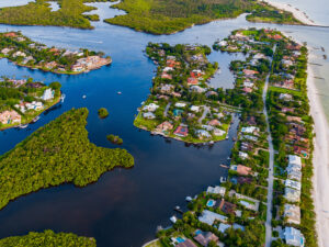 Aerial view of Gordon Pass and Naples Bay with luxury homes and waterways