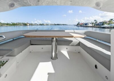 Spacious cockpit seating an elegant table—perfect for dining, lounging, or popping bubbly with your crew.