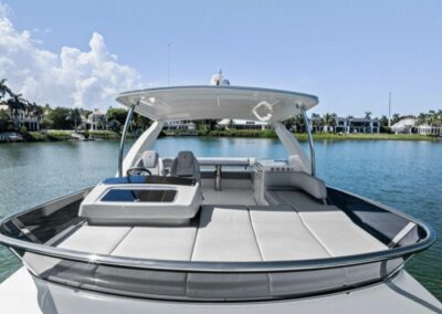 Luxury bow seating with recliners and table—your front-row seat to Gulf breezes, sunshine, and stunning views.